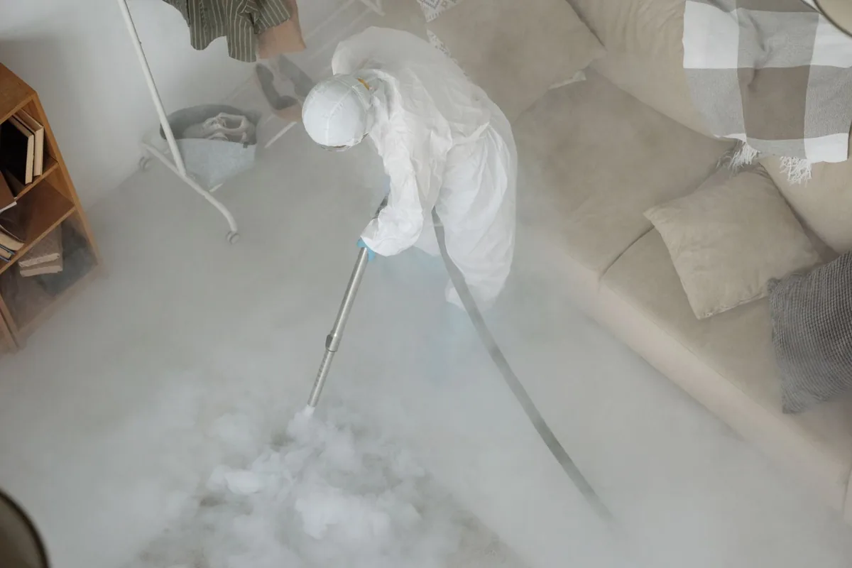 Biohazard cleanup technician in protective equipment, Belcourt, ND